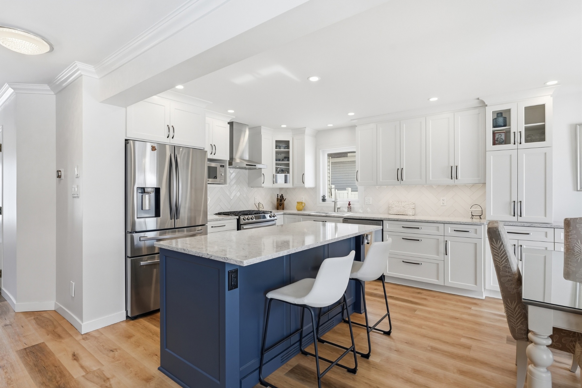 Bright modern kitchen with navy island